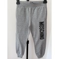 Unisex teplákové nohavice s logom sivé MOSCHINO